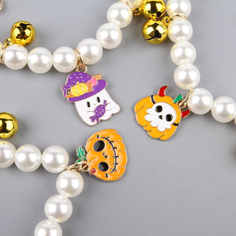 Halloween cat collar with simulated pearl decoration showing purple ghost, skull pumpkin, and smiling pumpkin design options