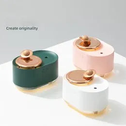 Rotating planet humidifier with USB charging port and night light in green, pink, or white colours