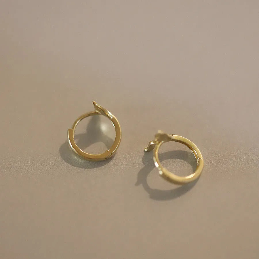 Gold plated fishtail hoop earrings made from sterling silver, showing 8mm inner diameter