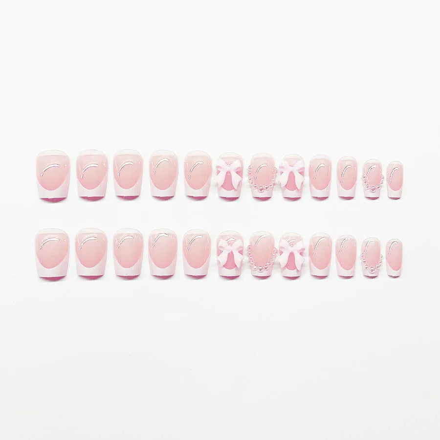 Short white French artificial nails with bow and tulip designs in European square shape