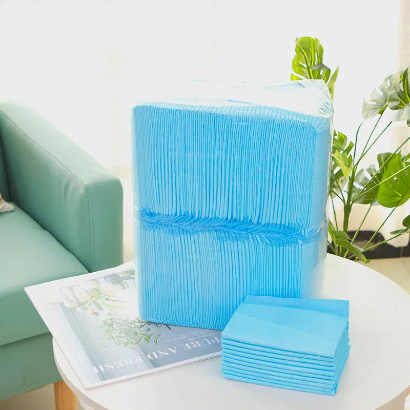 Pack of pet urinal pads showing different sizes and models including bamboo charcoal variant