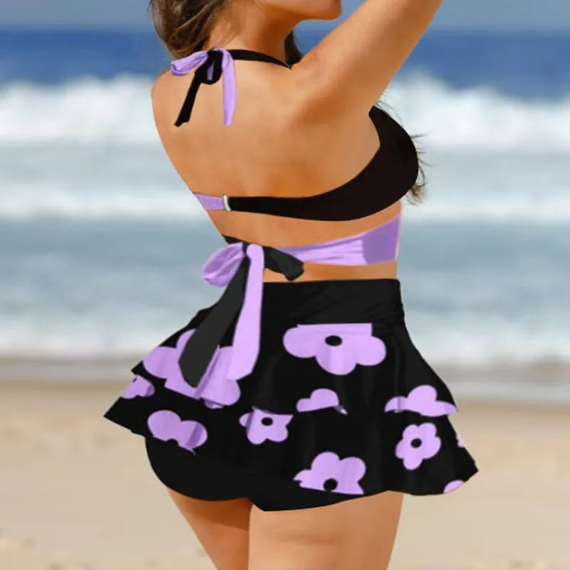 Purple women's high-waist bikini swimsuit with split skirt and lace-up detail