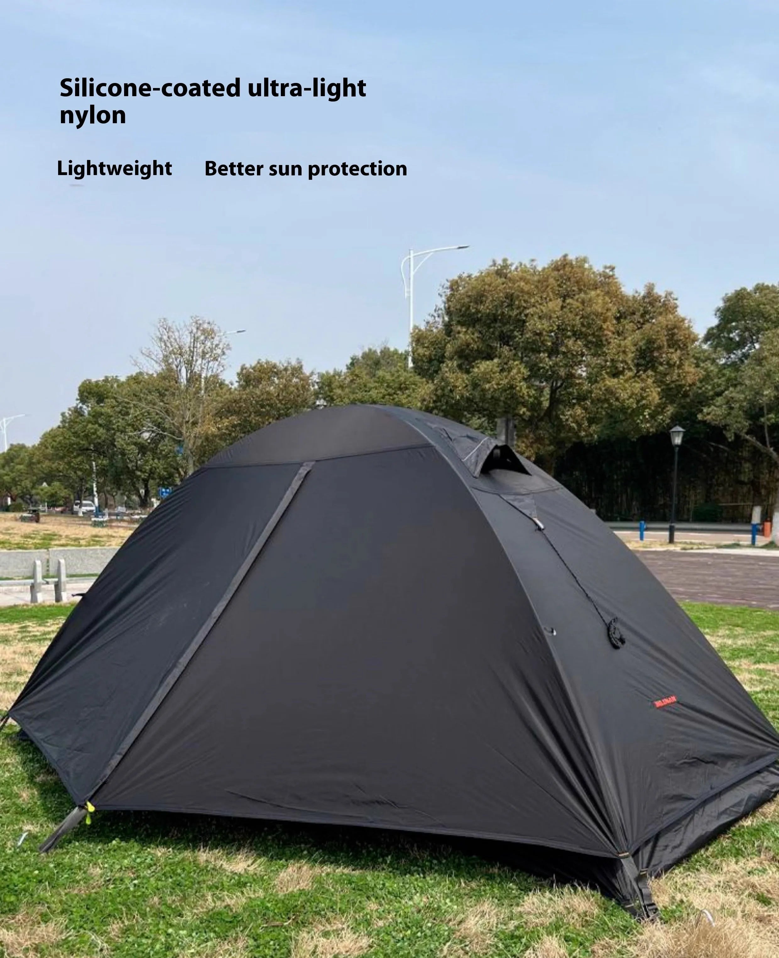 Single person lightweight camping tent with aluminium poles shown in a red colour option, fully expanded.