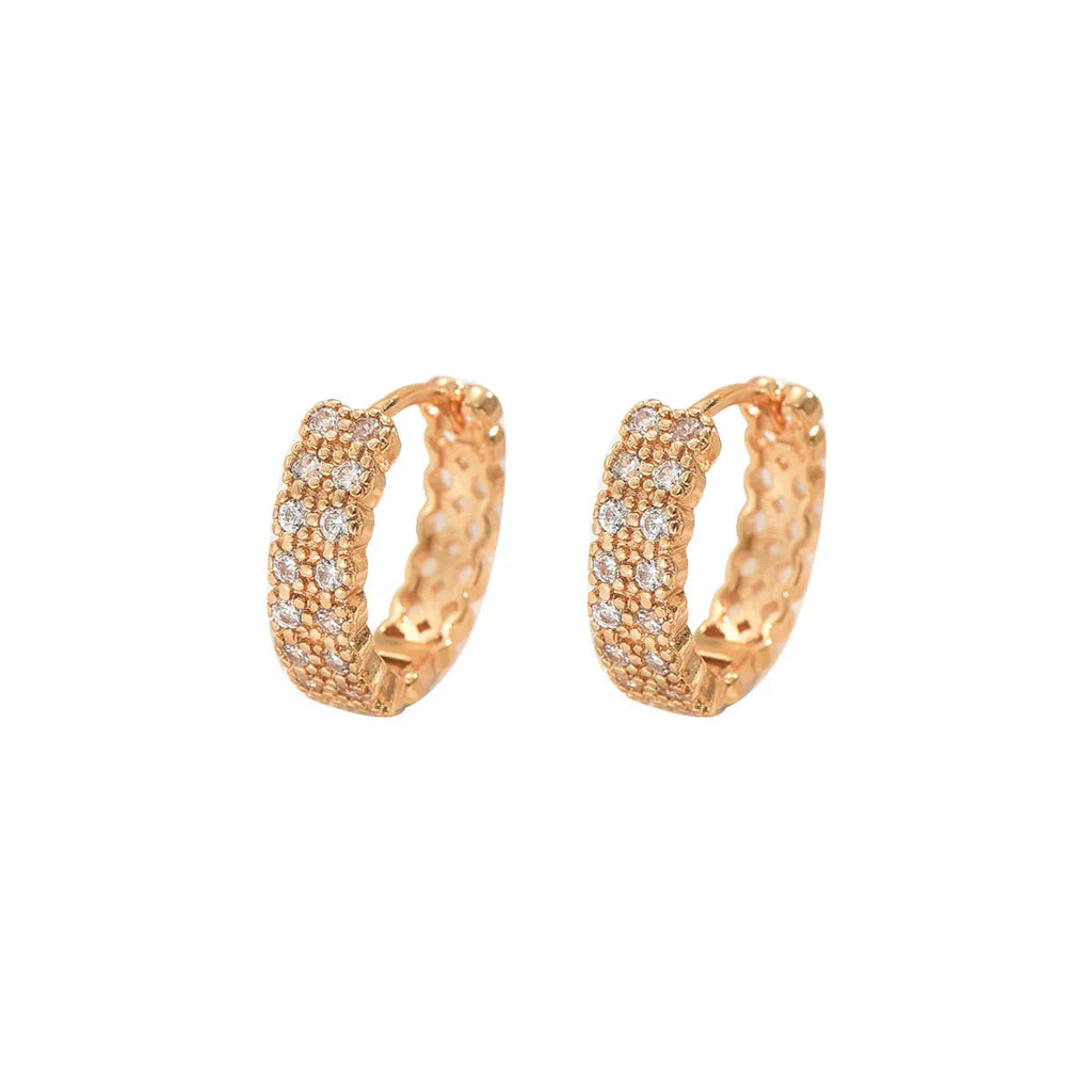 Geometric pattern copper ear studs with circular dot and ring decorative elements on ear