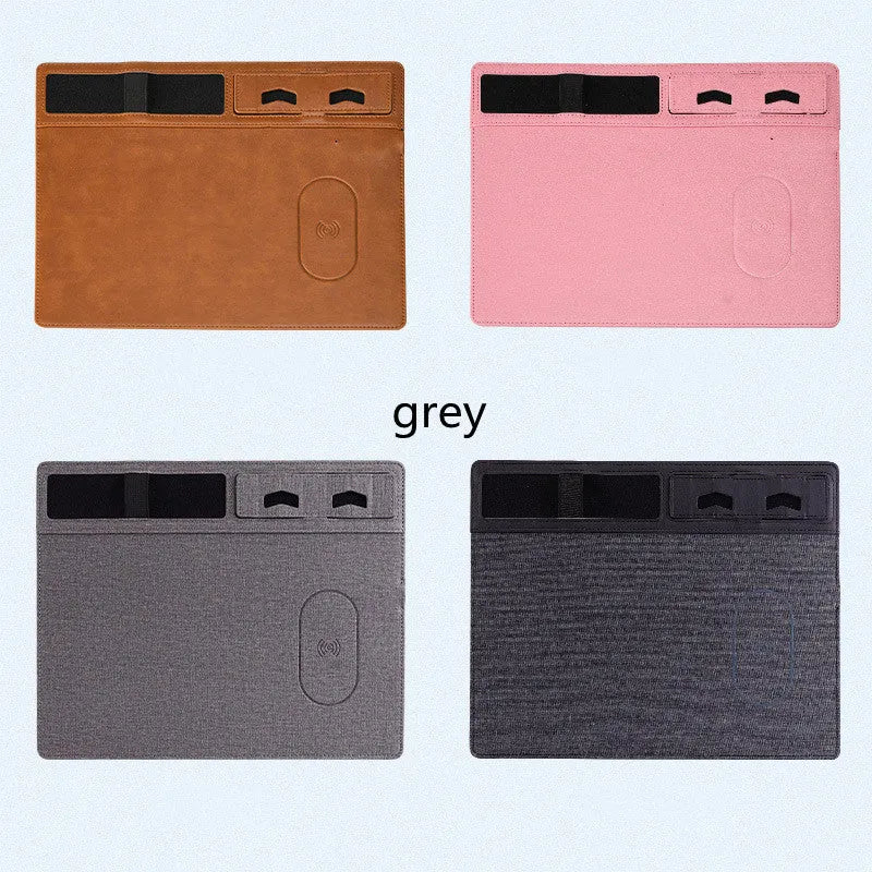 Pink wireless charging mouse pad with phone holder on a desk, showing USB cable and 320x260mm size.