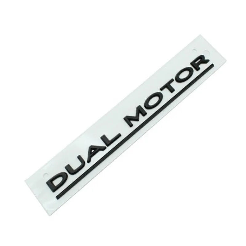 Black and red ABS plastic performance letter sticker for Tesla Model 3 bumper, measuring 19cm long.