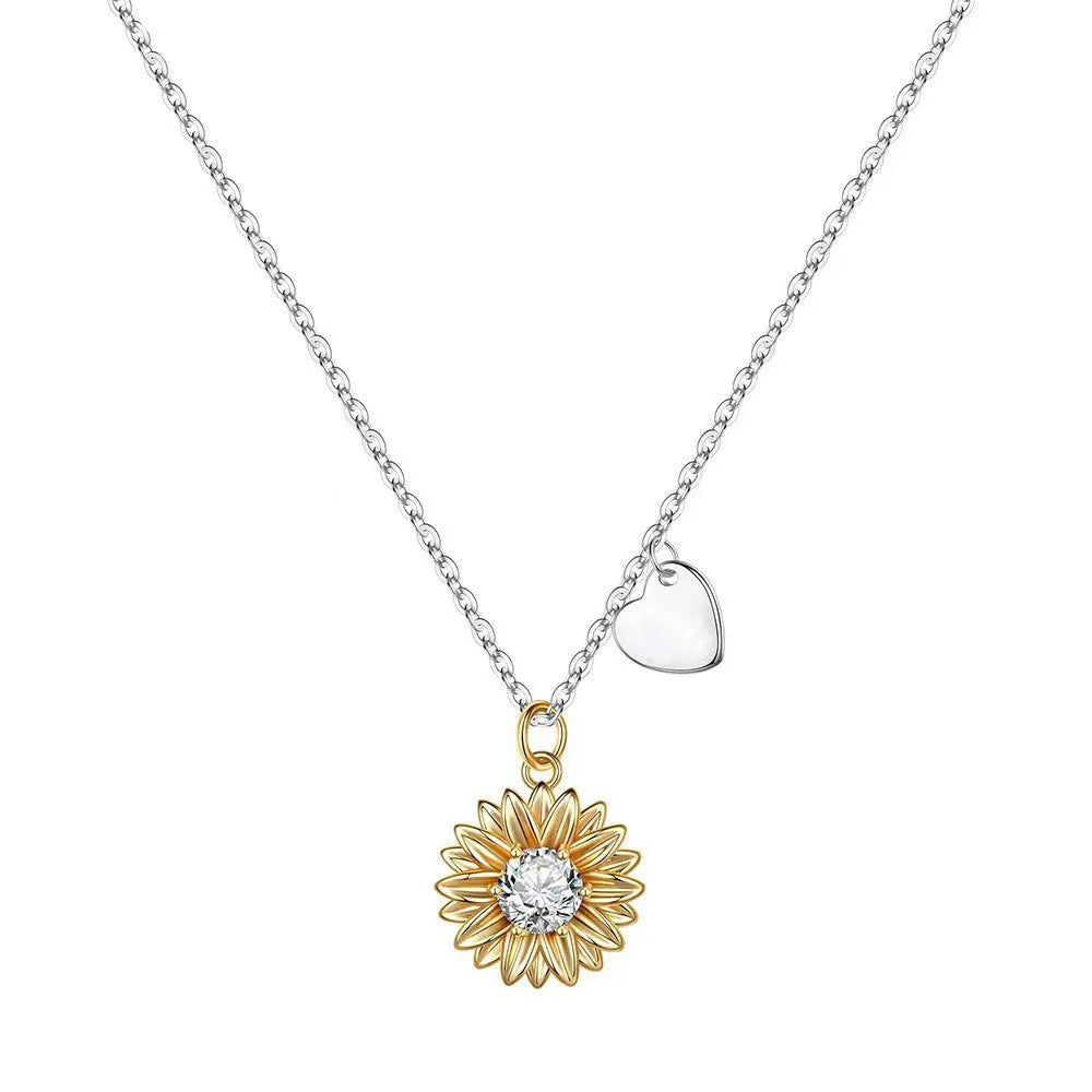 Close-up of a women's 925 silver necklace with a small daisy petal pendant on a cross chain, laid flat to show length.