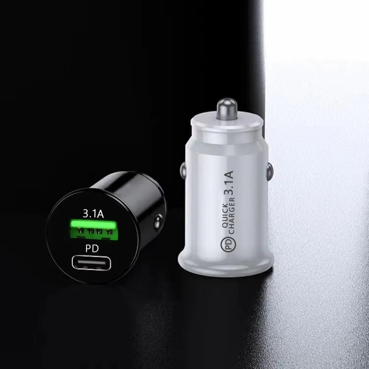 Black dual port car charger inserted in vehicle 12V socket with two USB cables connected
