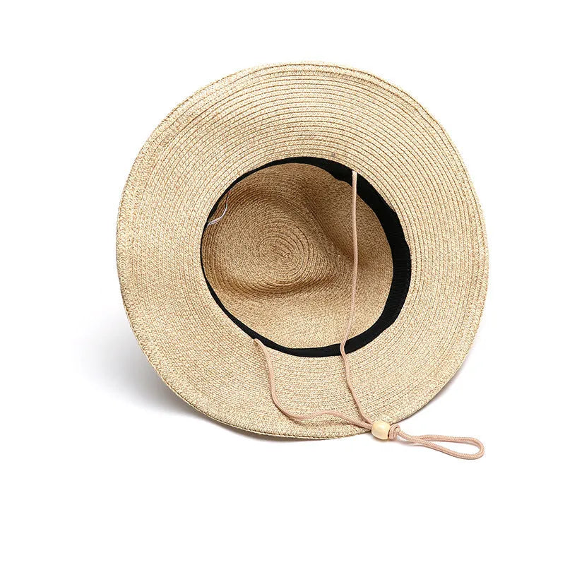 Men's foldable straw sun hat with wide brim shown in beige colour