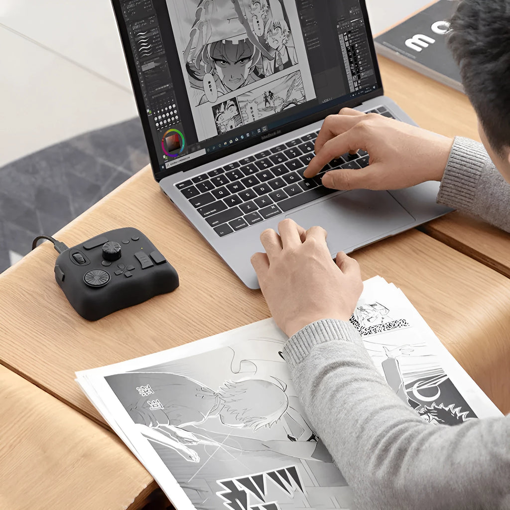TourBox NEO programmable auxiliary keyboard for video editing and digital creation on a desktop.