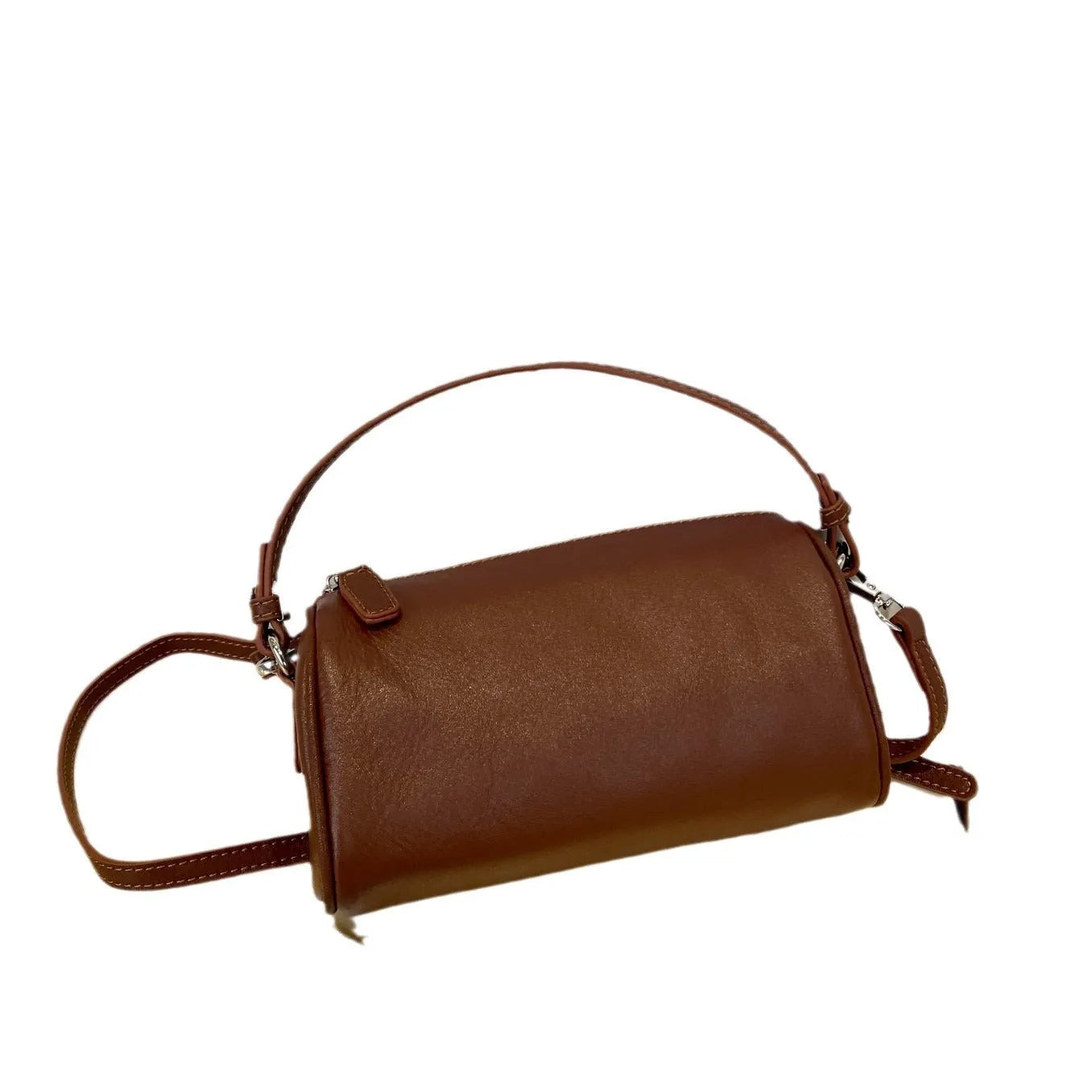 Soft brown genuine leather cylindrical crossbody phone bag with adjustable strap.