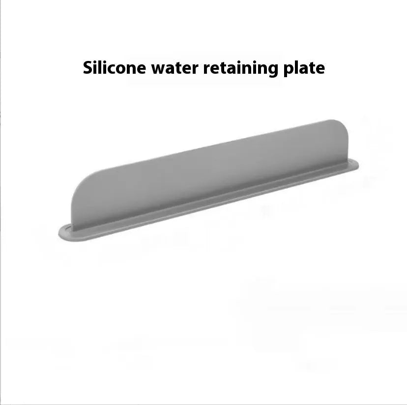 A thick grey silicone kitchen sink water blocking plate or splash guard measuring 52mm by 85mm.