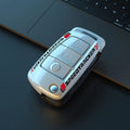 Carbon fibre style car key cover with mirror element in carbon and white colour options