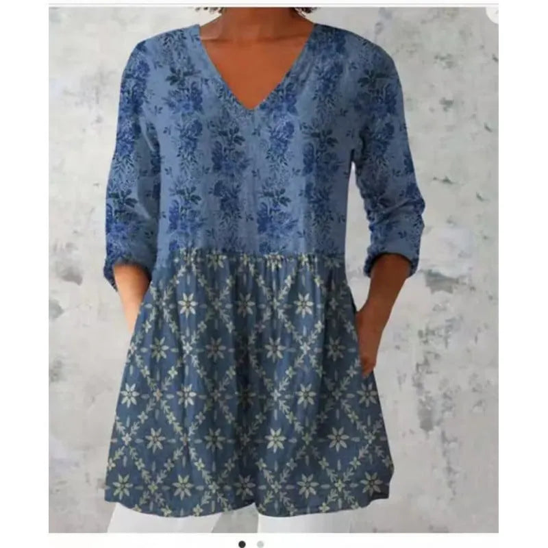 Women's printed wave pattern loose dress with wide waist and 3/4 length sleeves.