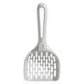 Grey plastic cat litter scoop with attached stand, shown next to a litter box.