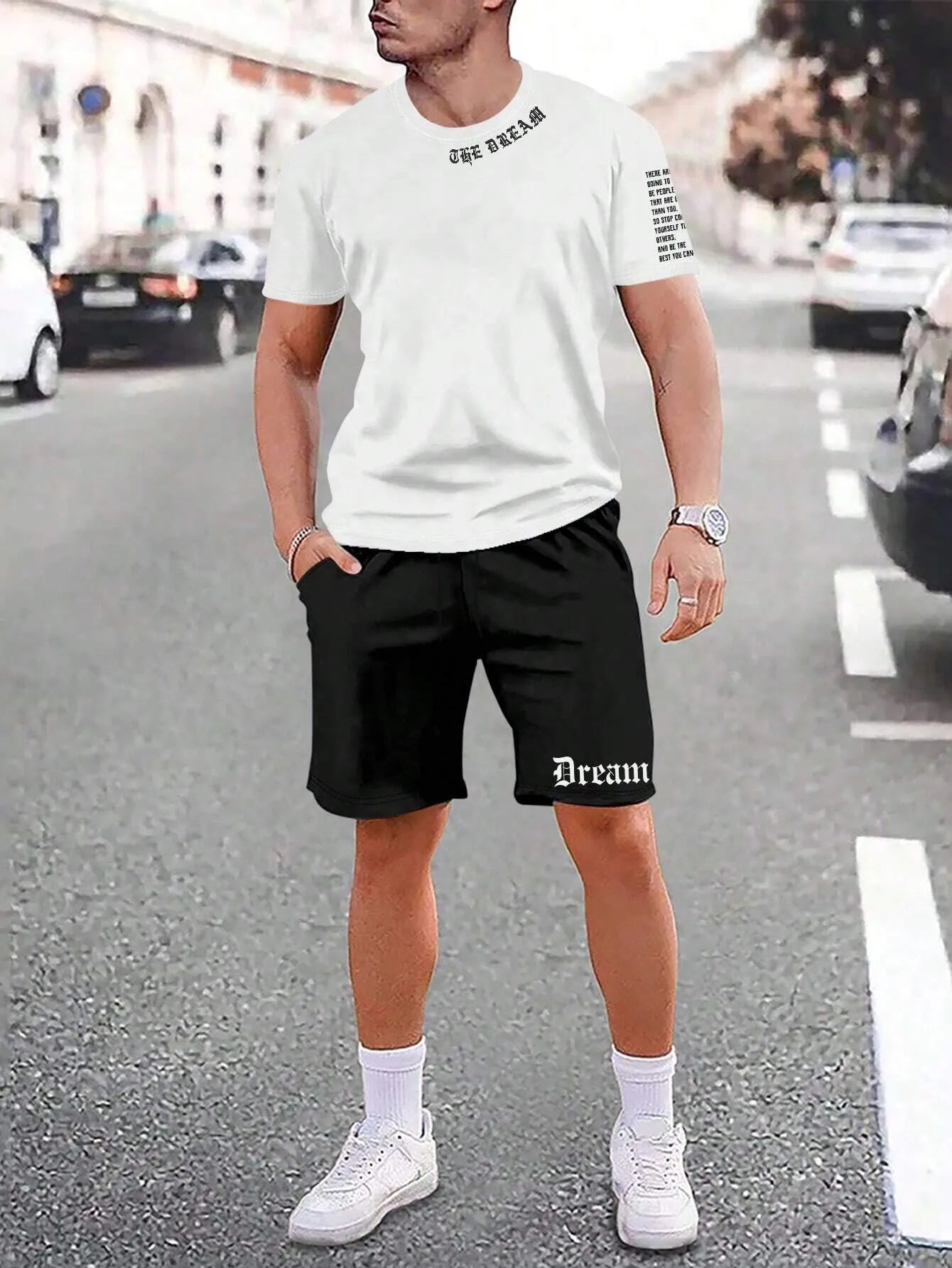Men's grey sports short sleeve top and matching shorts set on hanger