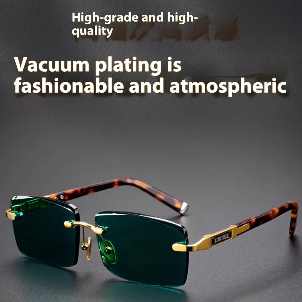 A pair of dark green frameless crystal sunglasses with a gold-tone temple arm on a case.