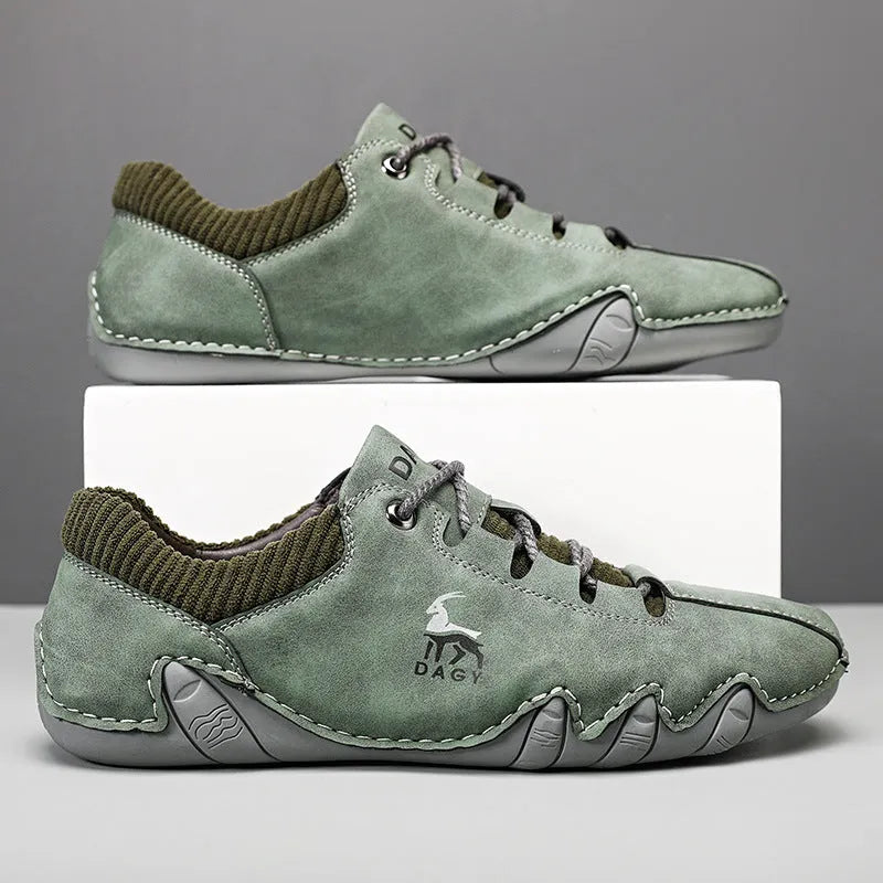 Men's solid colour lace-up casual sneakers with car stitching, blue upper, side view