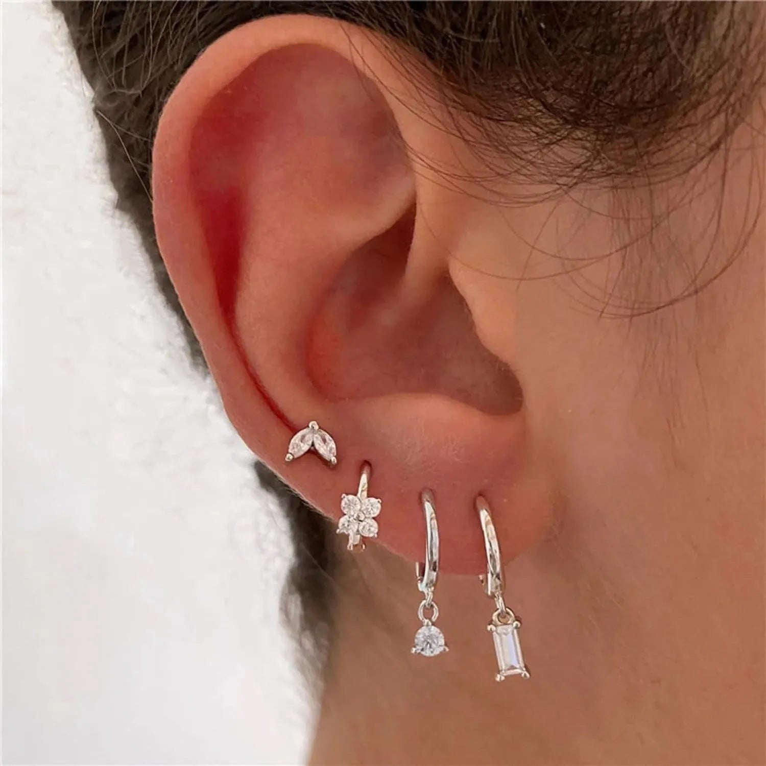 Geometric copper earring set with gold electroplated finish showing star and square shapes