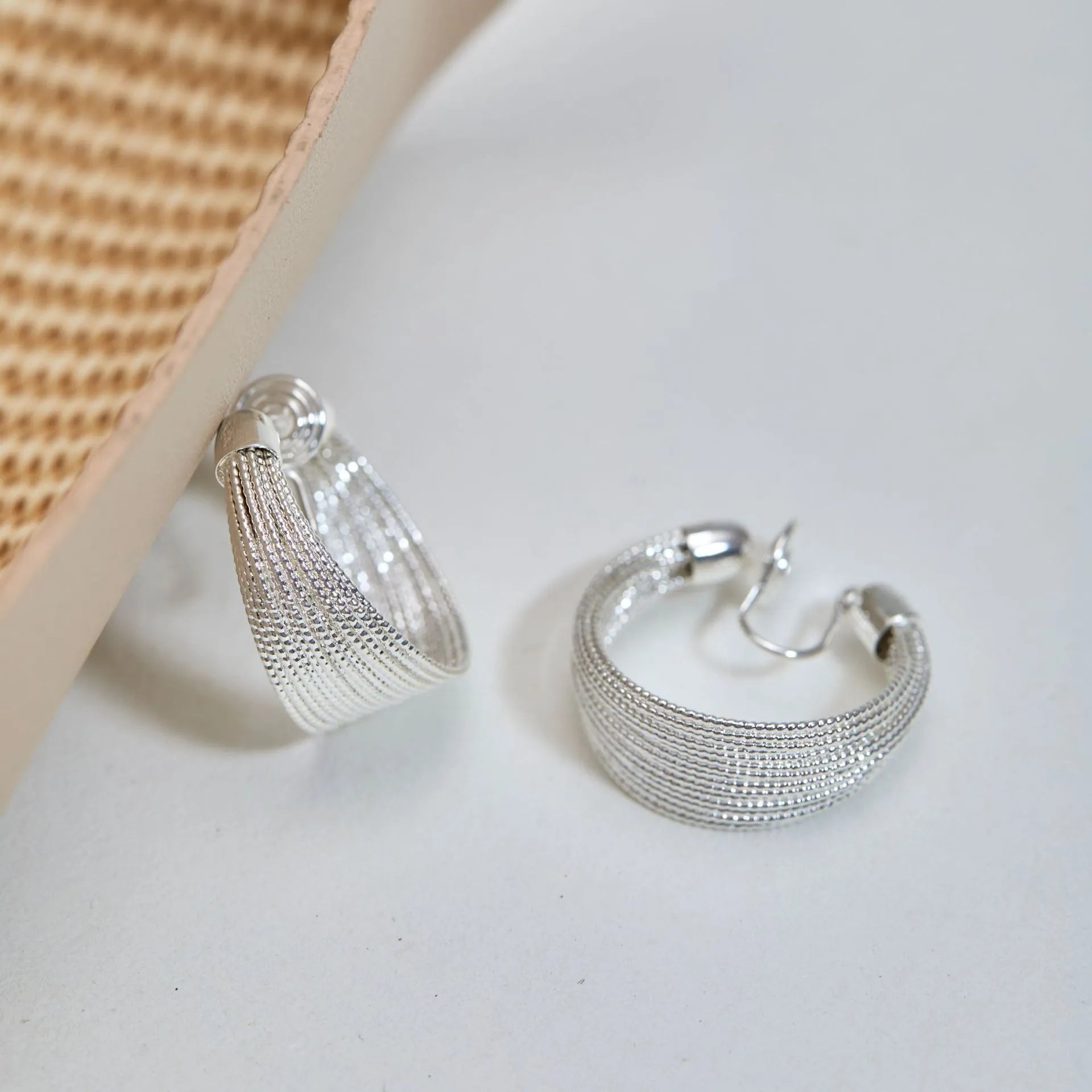 Geometric multi-layer simple bracelet earrings in gold and silver finishes with copper construction