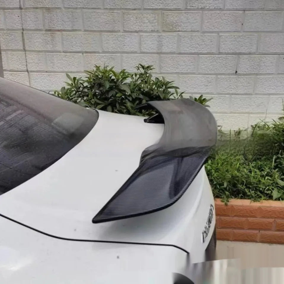 Universal punch-free ABS plastic car tail wing spoiler shown in carbon fibre pattern finish