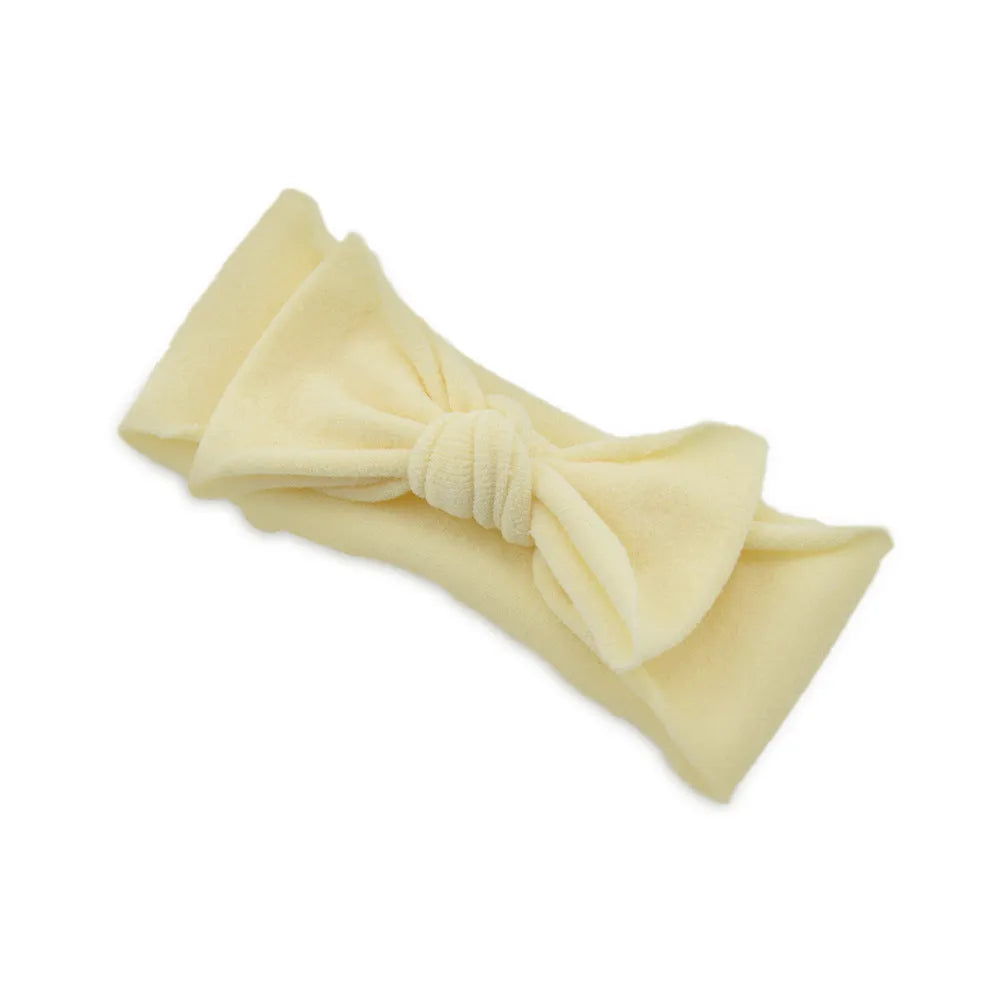 Solid colour knotted cloth headband for baby girls with bowknot design, available in 37 colours