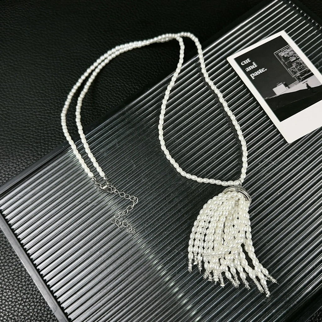 Women's pearl tassel necklace with long rice imitation pearl pendant and electroplated chain