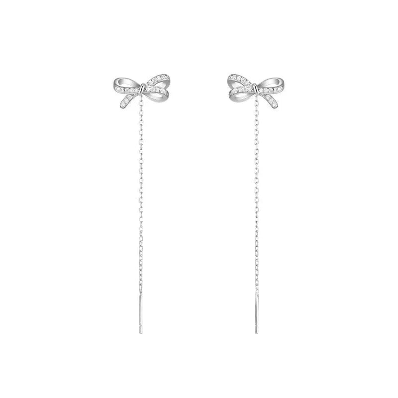 Women's white K bow earrings with long tassel ear thread, copper construction