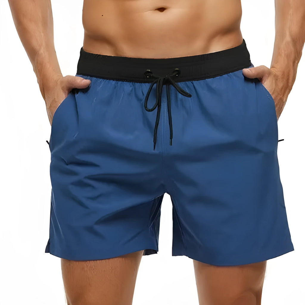 Men's blue athletic shorts with a stitching waistband, drawstring, and side headband pocket.