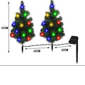 Solar Christmas tree lamp garden decoration with IP65 ABS construction placed in outdoor courtyard