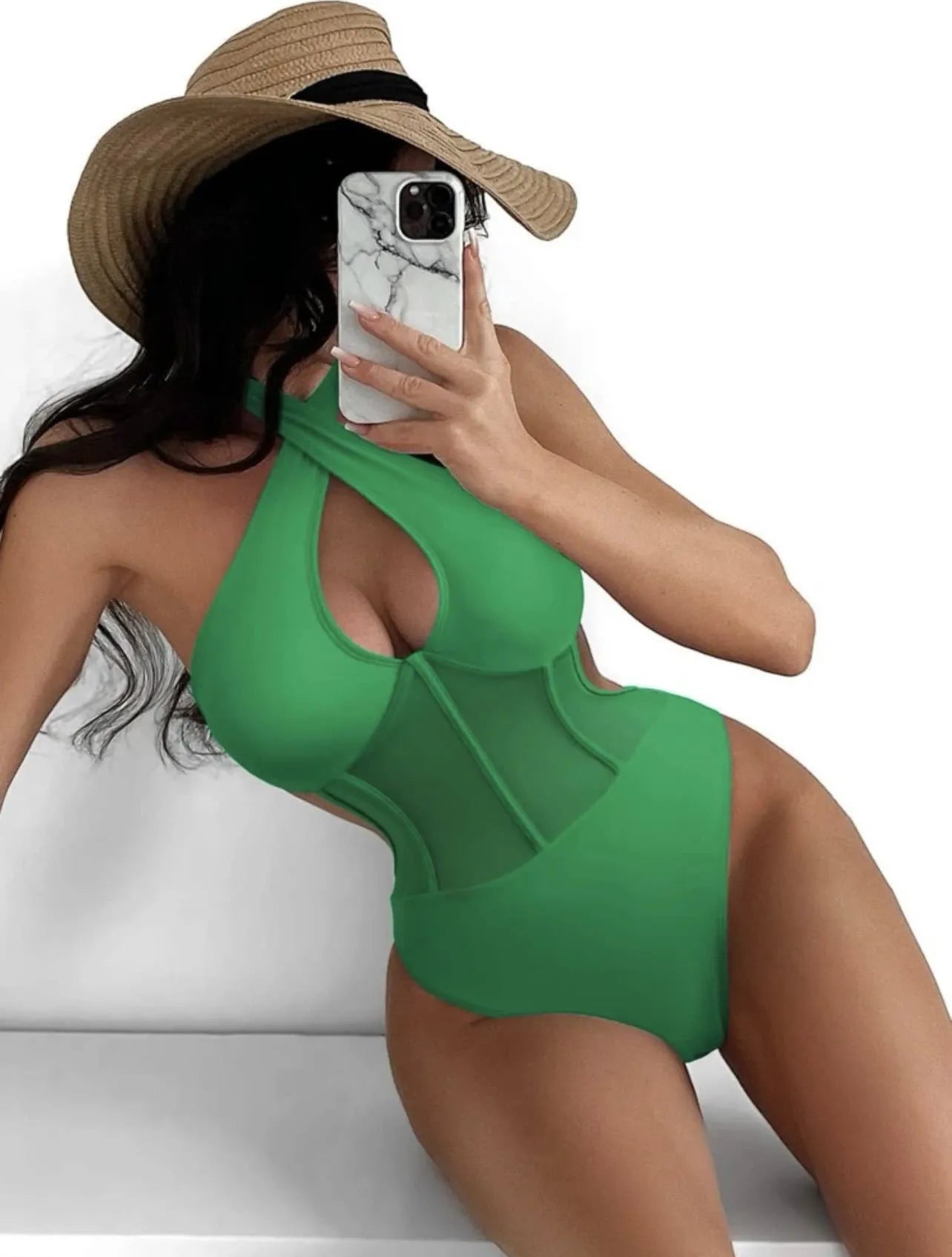 A black ladies one-piece swimsuit bikini made from nylon and spandex fabric on a neutral background.