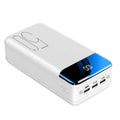 Black and white large capacity 50000mAh power bank with multiple USB ports for charging.