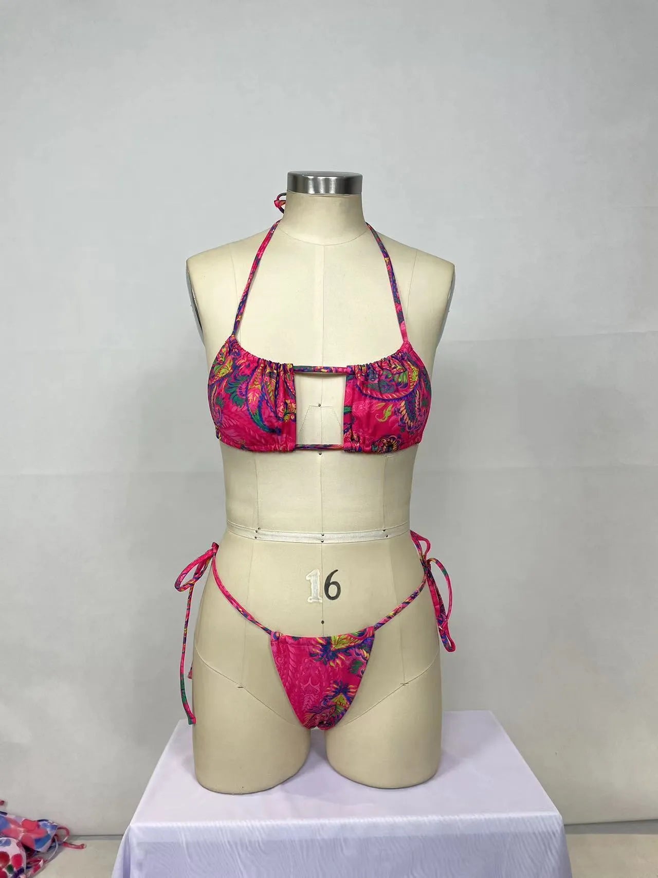 Women's printed bikini two-piece set in pink with triangle top and high-waist bottoms