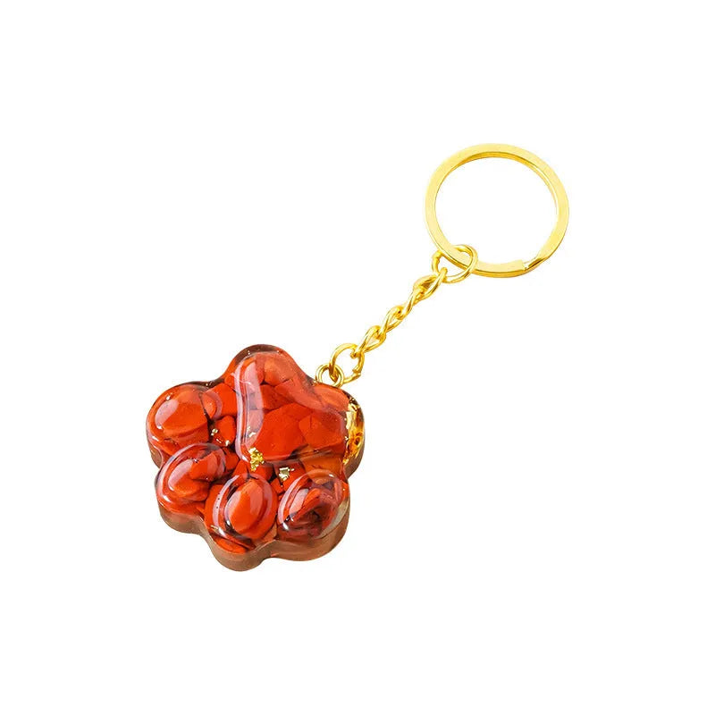 Small natural crystal cat's paw claw charm on a metal loop keychain
