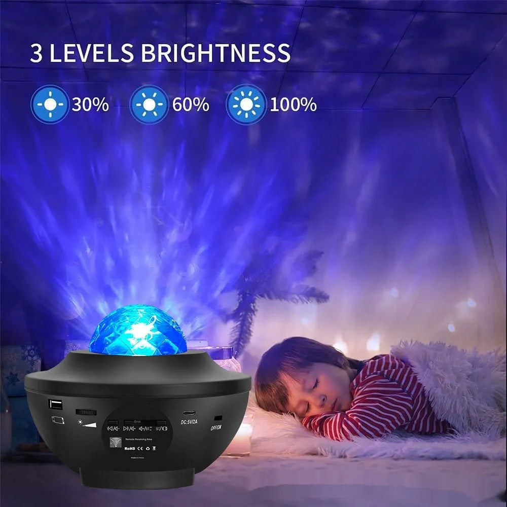 Black parallel finish star projector lamp with rotating water ripple laser effects on desktop