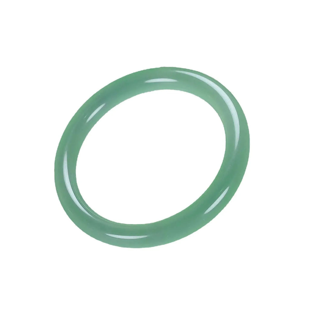 Jade bracelet with carved floating flower and auspicious cloud pattern in emerald green.