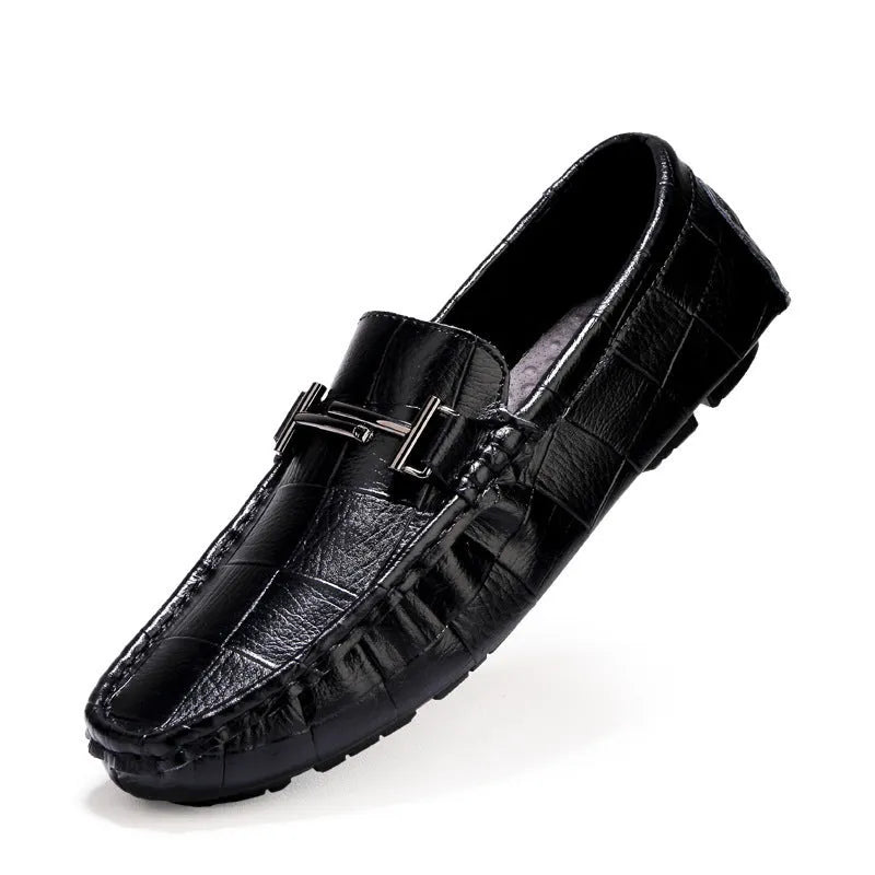 Men's low-cut leather casual shoe with a silver buckle fastener on a flat rubber sole.