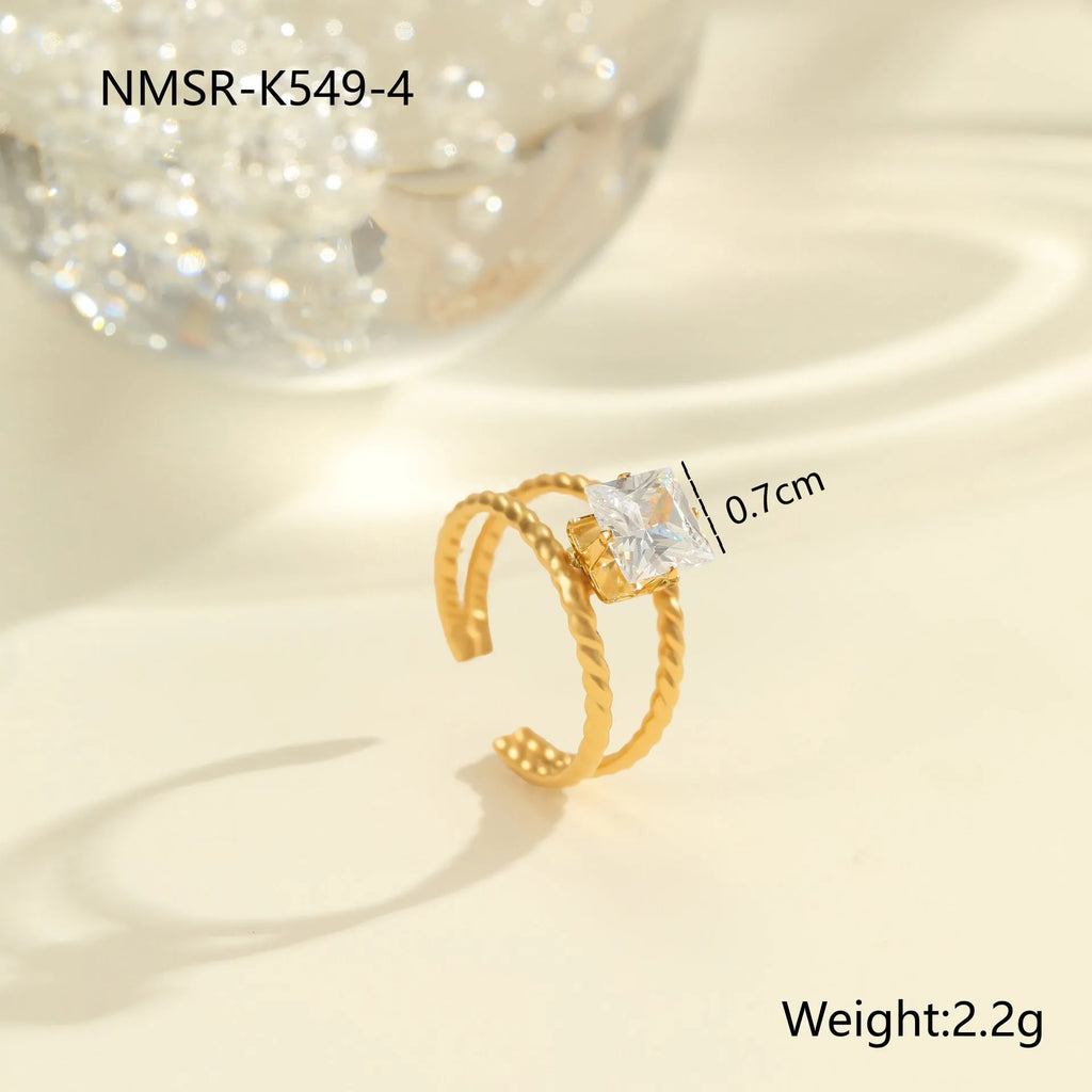 Gold electroplated stainless steel ring with zircon geometric designs and open mouth adjustable fitting