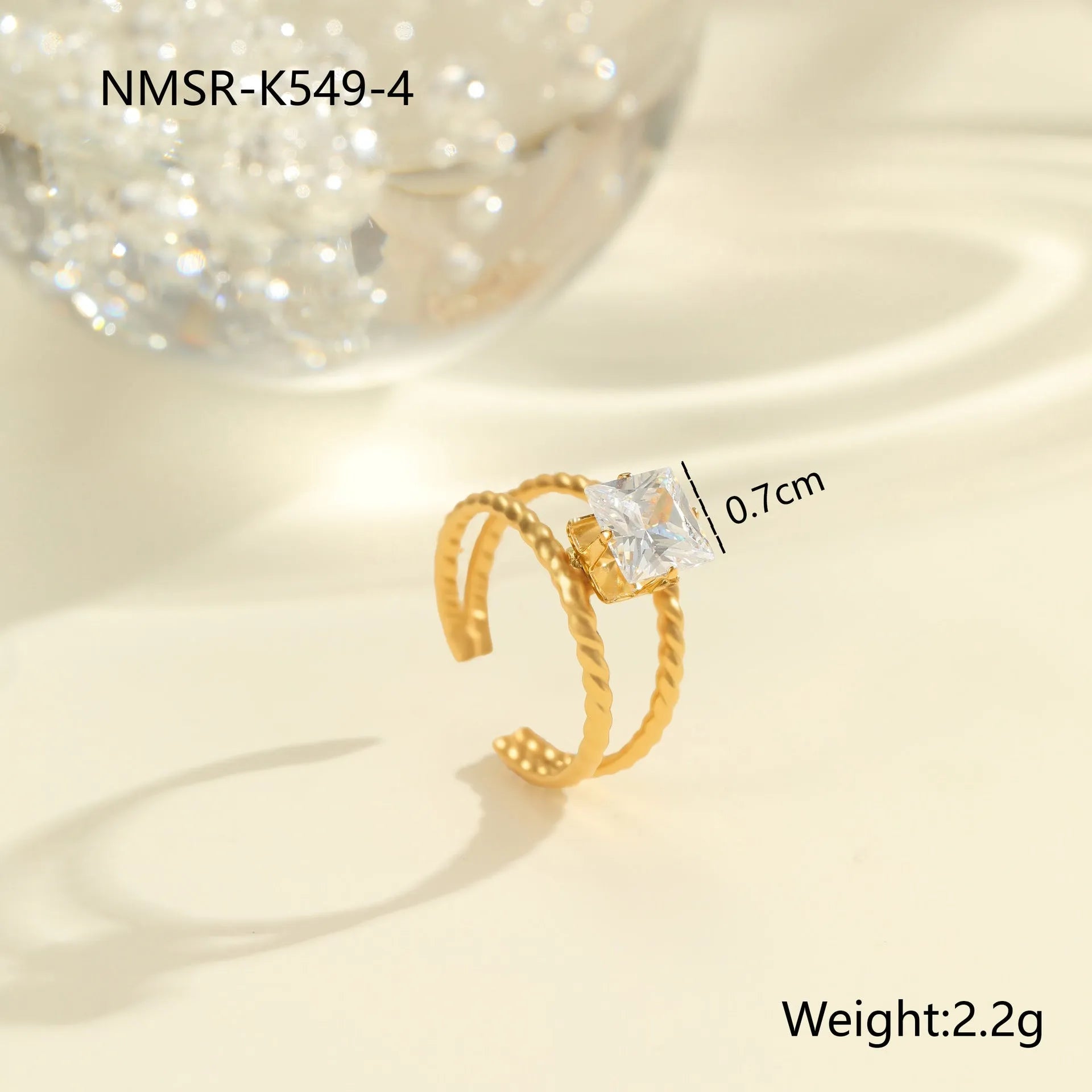 Gold electroplated stainless steel ring with zircon geometric designs and open mouth adjustable fitting