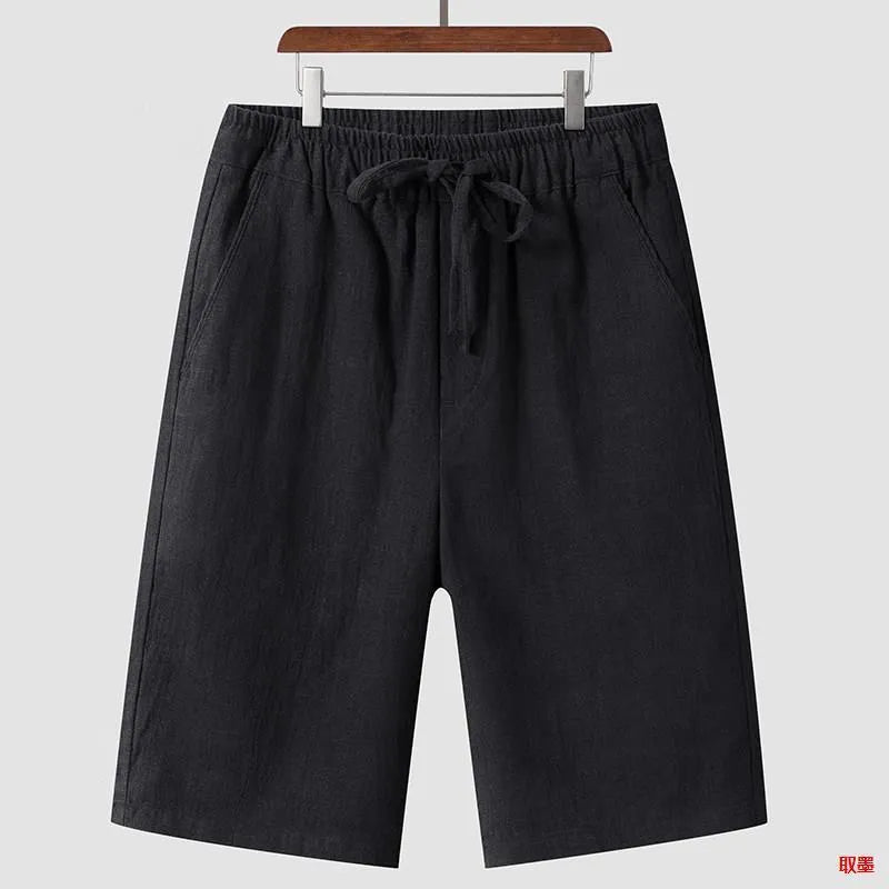 Men's loose-fit linen shorts in a cropped mid-length style with an elastic waistband.