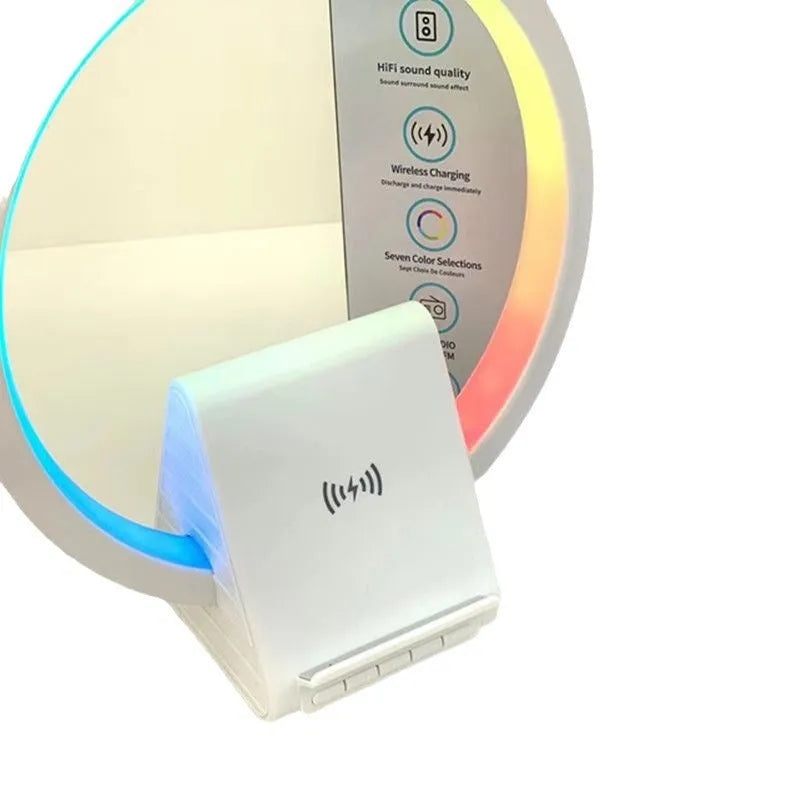 White rectangular smart Bluetooth speaker with integrated wireless charging pad and ambient light on a desk
