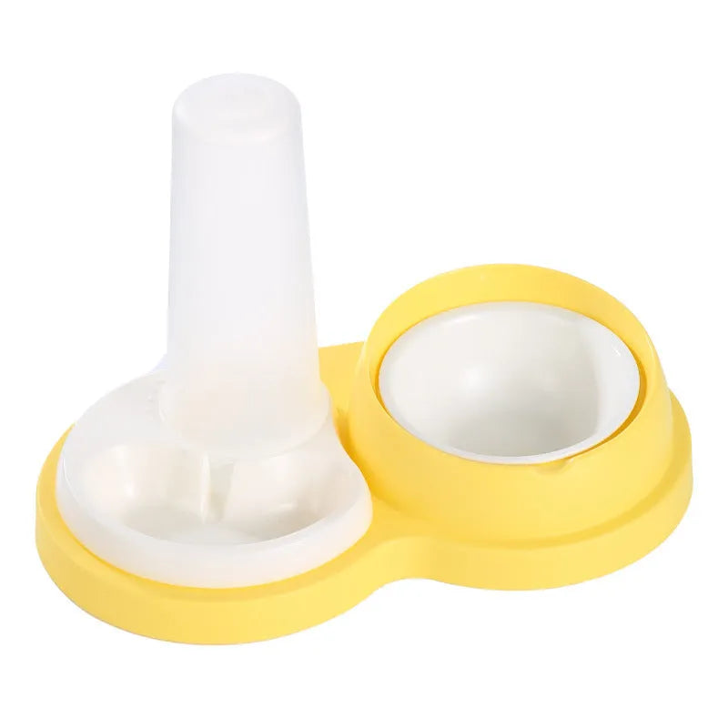 Grey and yellow dual pet feeding bowl with raised neck support and separate food and water compartments.