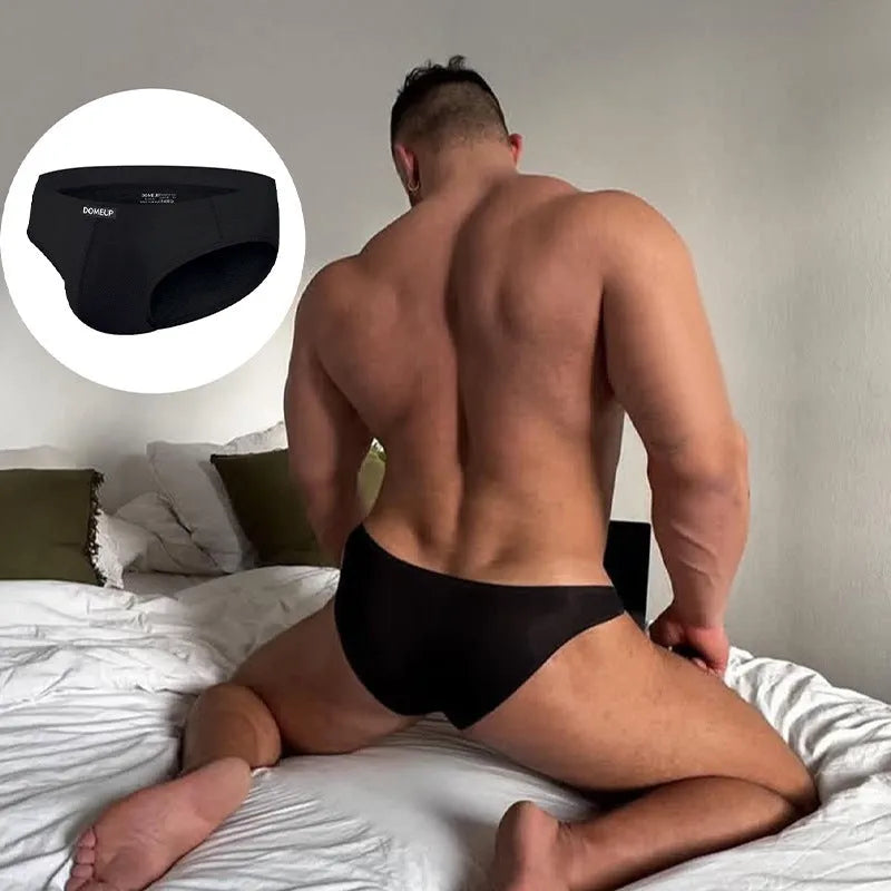 Men's solid colour low-waist seamless briefs in white, black, and pink on a size chart.
