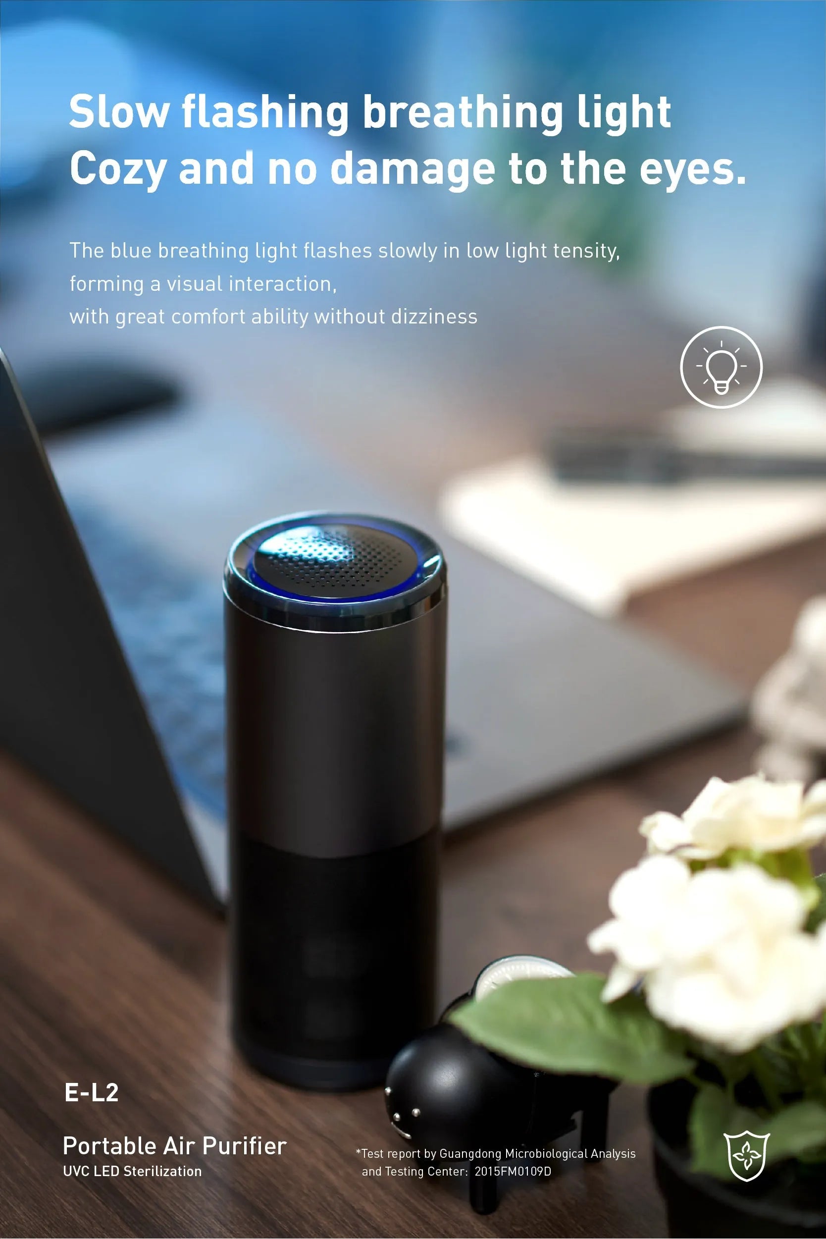 Black portable mini car air purifier with metal body and coloured light display on a desk