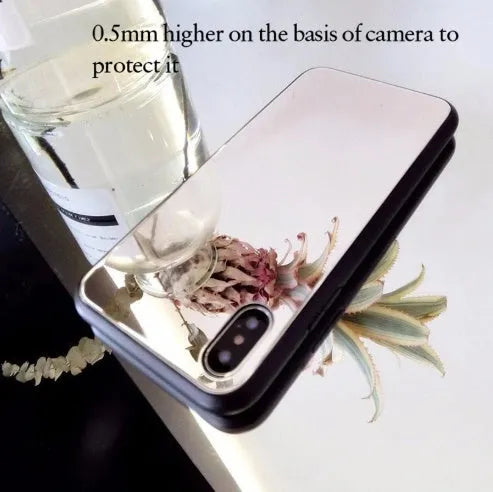 Black iPhone case with a built-in mirror on the back, compatible with iPhone X and iPhone 7 Plus models.