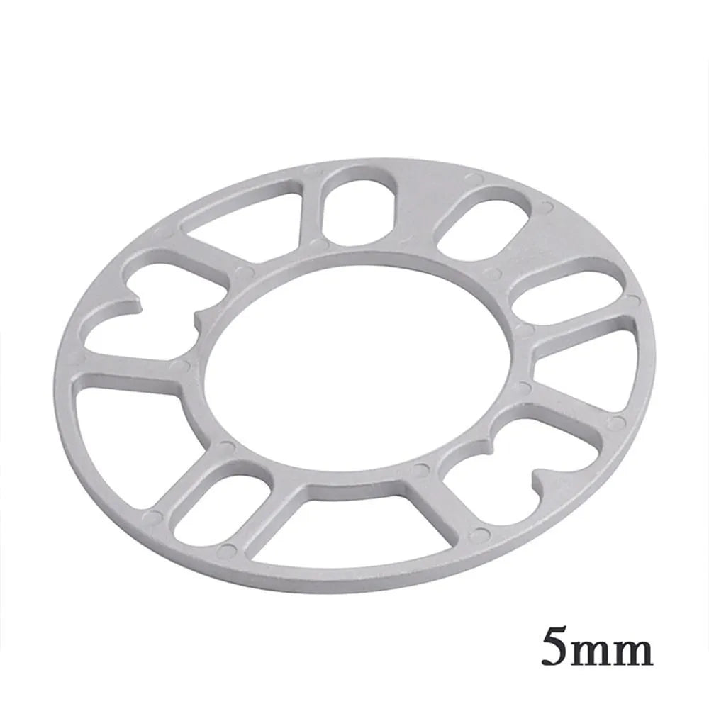 A single, circular metal automotive wheel hub spacer gasket for modifying wheel offset and brake clearance.