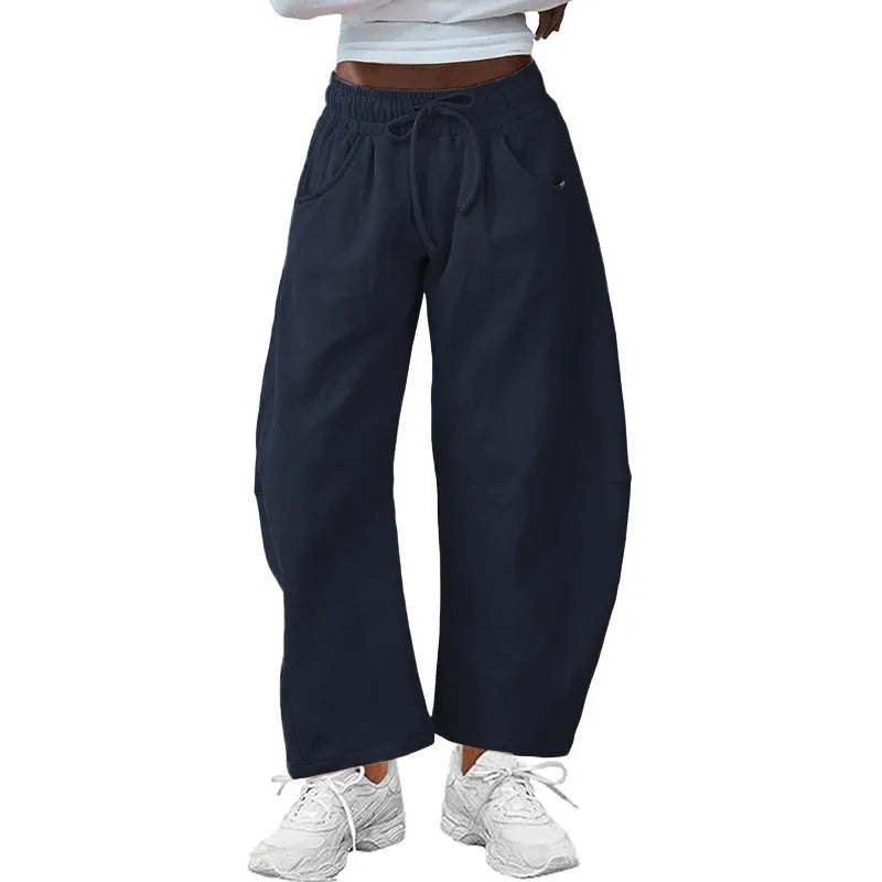 Women's loose cropped sweatpants with drawstring elastic waist and side pockets in street fashion style