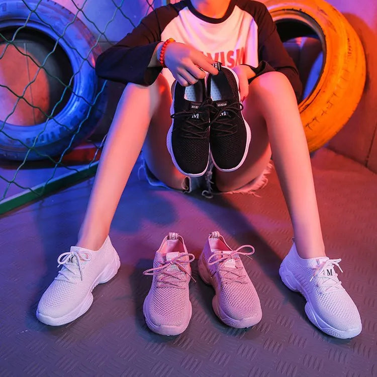 Women's white thick-soled casual trainers with woven upper and front strap design