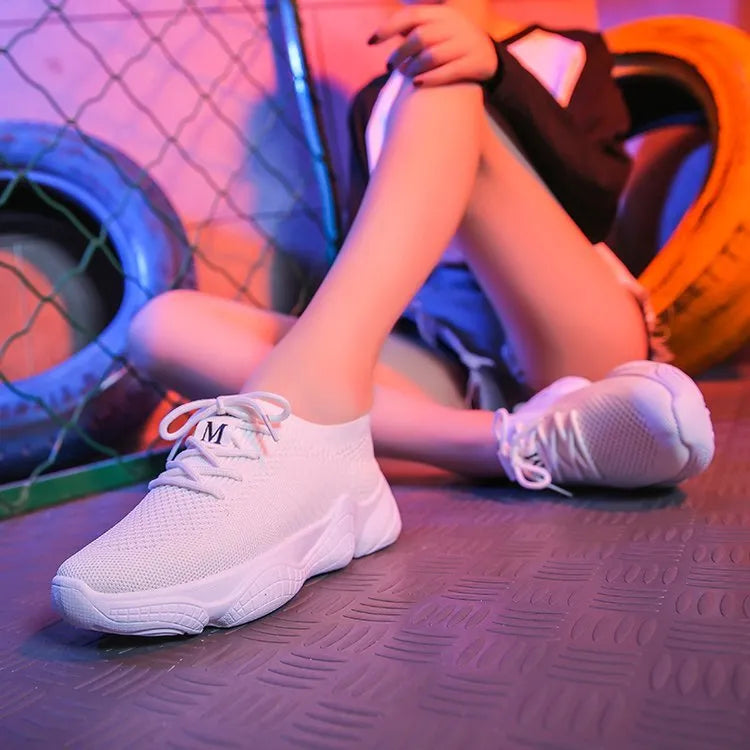 Women's white thick-soled casual trainers with woven upper and front strap design