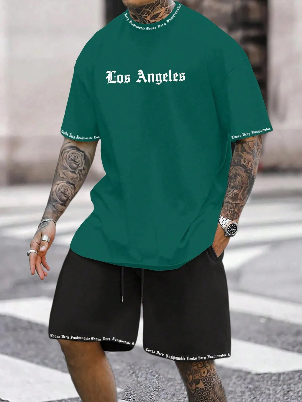 Men's grey sports short sleeve top and matching shorts set on hanger